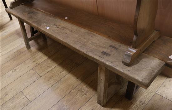 An oak bench stool, W.198cm